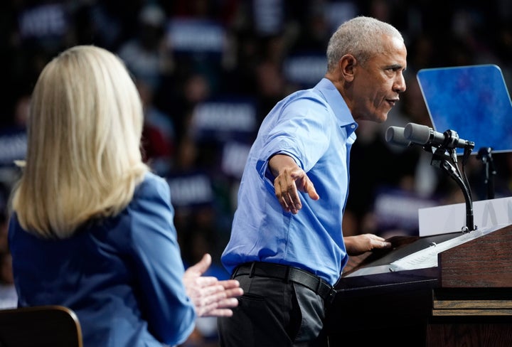 Former President Barack Obama, gestures during a rally for Virginia Democratic gubernatorial candidate Abigail Spanberger, left, Saturday, Nov. 1, 2025, in Norfolk, Va. (AP Photo/Steve Helber)
