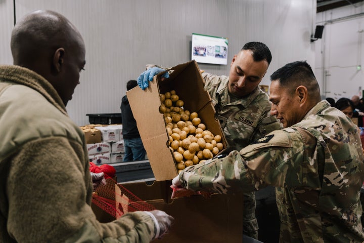 California National Guard members sort donated food items at the Los Angeles Regional Food Bank warehouse on Oct. 31. Two federal judges ruled that the Trump administration's decision to suspend SNAP benefits for more than 42 million Americans during the government shutdown is likely unlawful, and that officials must use contingency funding to at least partially keep the program operational.