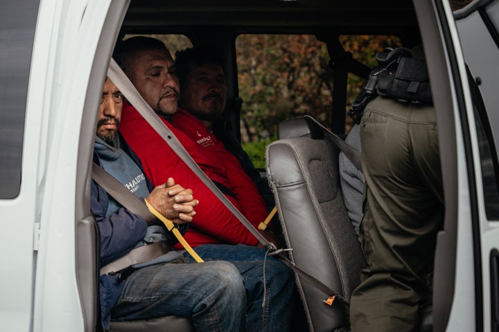 Federal immigration agents take several people detained that same day to a parking lot on Chicago's far north side before transferring them to an ICE facility on Oct. 31, 2025.