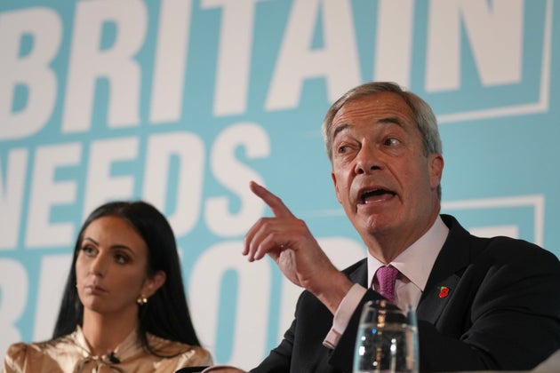 Britain's Reform UK leader Nigel Farage, right, and abuse survivor Ellie-Ann Reynolds attend a news conference in London, England, Monday, Oct. 27, 2025. (AP Photo/Kin Cheung)