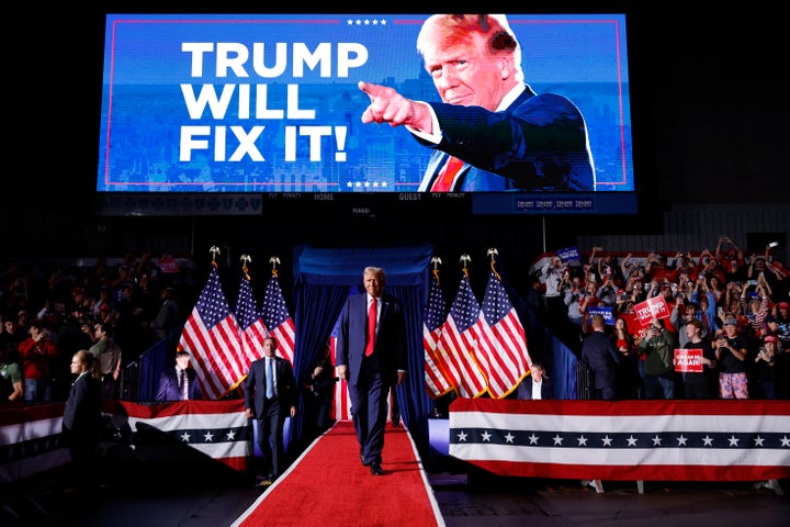 Donald Trump one year ago at his last rally of the 2024 presidential campaign in Grand Rapids, Michigan.
