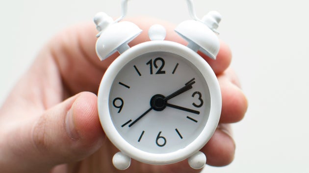 hand holding clock