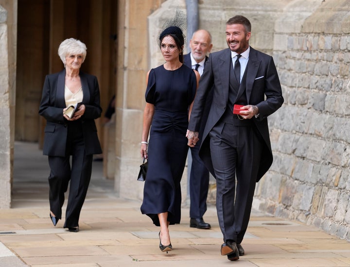 d 1 Sir David Beckham with his wife, Lady Victoria, and parents, Ted and Sandra, after being knighted at an investiture ceremony at Windsor Castle.