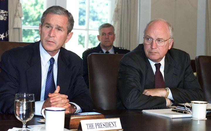 Then-President George W. Bush meets with Vice President Dick Cheney and other Cabinet members at the White House to discuss the attacks on the United States Sept. 12, 2001, in Washington, D.C.