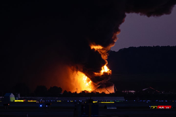 A fireball erupts near airport property after reports of a plane crash at Louisville International Airport, Tuesday, Nov. 4, 2025, in Louisville, Ky.