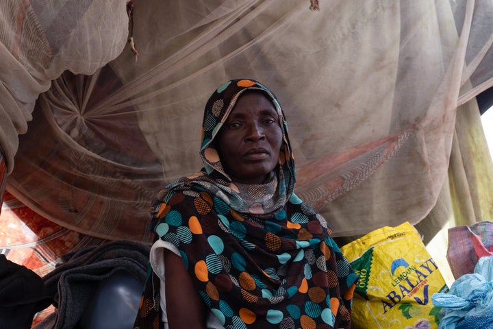 A displaced Sudanese woman, who fled El-Fasher after the city fell to the Rapid Support Forces (RSF), sits in her makeshift shelter at the Um Yanqur camp on Nov. 3, 2025. The camp rests on the southwestern edge of Tawila, in war-torn Sudan's western Darfur region.