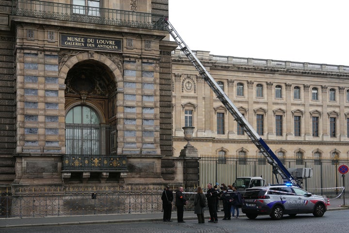 Louvre’s Surveillance System Password At Time Of Jewel Theft Was Dumber Than You Can Think about 1 French police officers stand next to a furniture elevator used by robbers to enter the Louvre Museum, on Quai Francois Mitterrand, in Paris on Oct.