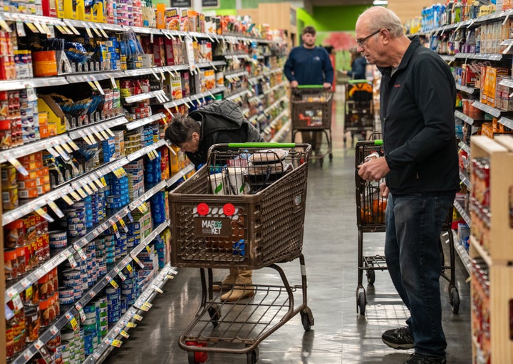 Shoppers look at a canned fish display November 4, 2025 at the Market 32 Supermarket in South Burlington, Vermont. (Photo by Robert Nickelsberg/Getty Images)