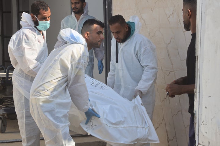 Teams from the International Committee of the Red Cross (ICRC) are brought the bodies of 15 Palestinians to Nasser Hospital after handed over by Israel under cease-fire and hostage-prisoner exchange agreement, in Khan Yunis, Gaza on November 8, 2025. (Photo by Abdallah F.s. Alattar/Anadolu via Getty Images)