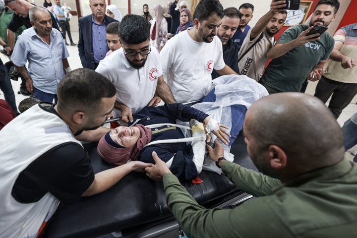 Palestinian Loss of life Toll In Gaza Tops 69,000, Native Health Officers Say 1 Palestinian photographer Raneen Sawafta reacts as she is carried on a stretcher at Rafidia Hospital in Nablus after reportedly being injured by Israeli settlers while covering the olive harvest in the Palestinian village of Baita, in the Israeli-occupied West Bank, on November 8, 2025. (Photo by JAAFAR ASHTIYEH/AFP via Getty Images)