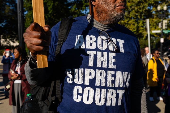 Demonstrators outside the Supreme Court in Washington, D.C., Oct. 15. The Supreme Court's conservatives suggested they will restrict the creation of majority-Black and majority-Hispanic voting districts in a case that could further undercut a landmark civil rights law and bolster Republican electoral prospects.