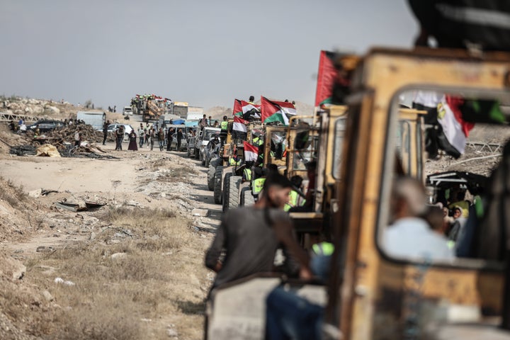 Dozens of heavy construction vehicles belonging to the Egyptian delegation arrive in central Gaza's Netzarim corridor to start rebuilding infrastructure for a new tent camp on Nov. 11, 2025.