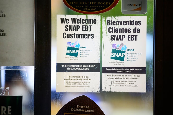 Supplemental Nutritional Assistance Program (SNAP) and Electronic Benefit Transfer (EBT) signage displayed outside a convenience store in Washington, D.C., on Nov. 4, 2025. President Donald Trump further muddied the fate of the Supplemental Nutrition Assistance Program with a social media post suggesting he would not provide benefits until after the government reopens. 
