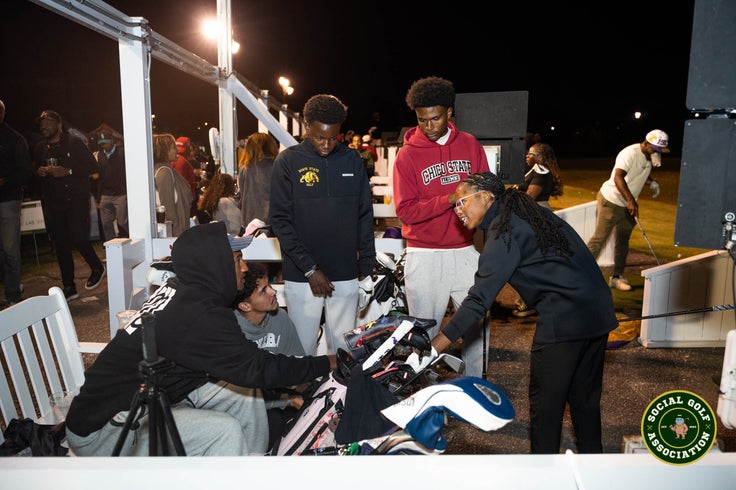 Range Night attendees have a spirited conversation.