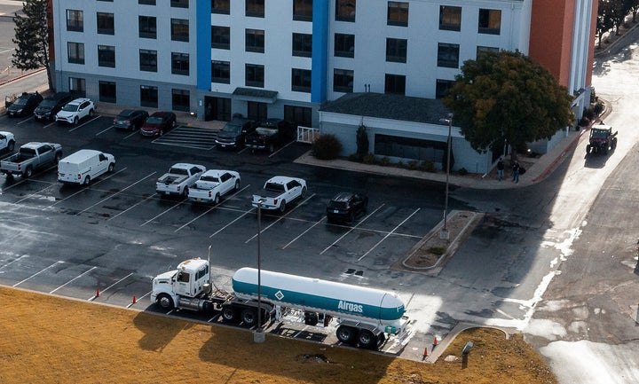 A tanker truck that leaked a chemical is seen in front of the Holiday Inn Express in Weatherford, Okla. on Thursday, Nov. 13, 2025. (AP Photo/Alonzo Adams)