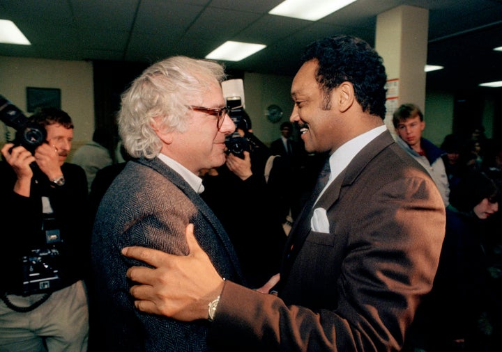Jackson embraces Bernie Sanders, then mayor of Burlington, Vermont, after the latter endorsed him for president in 1988.