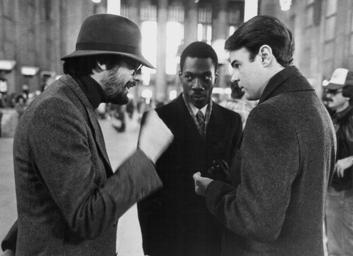 Director John Landis, left, with "Trading Places" stars Eddie Murphy and Dan Aykroyd in 1983. 