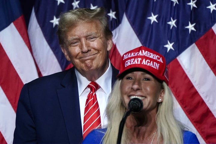 FILE: US Representative Marjorie Taylor Greene (R) speaks alongside former US President and 2024 presidential hopeful Donald Trump at a campaign event in Rome, Georgia, on March 9, 2024. (Photo by Elijah Nouvelage/AFP via Getty Images)