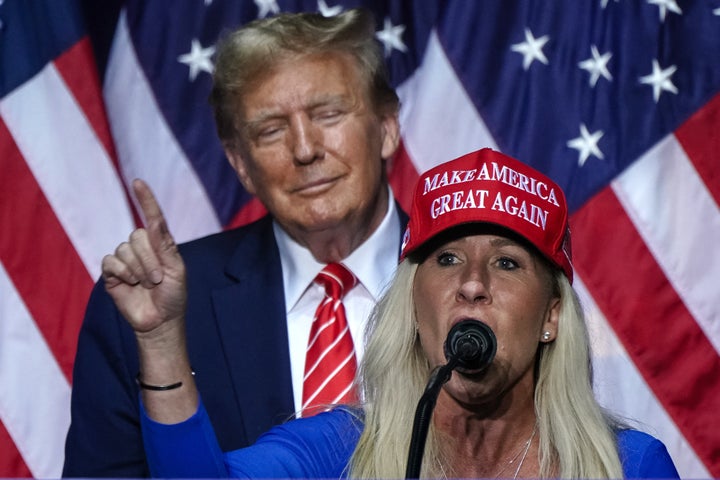 US Representative Marjorie Taylor Greene (R) speaks alongside former US President and 2024 presidential hopeful Donald Trump at a campaign event in Rome, Georgia, on March 9, 2024. (Photo by Elijah Nouvelage / AFP via Getty Images)
