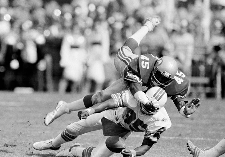 Seattle Seahawks safety Kenny Easley (45) tries to break up a Miami Dolphins pass to Mark Duper (85) but Duper held on only to drop the ball momentarily but finally kept possession during an NFL playoff football game in Miami, Dec. 29, 1984. (AP Photo/Raul Demolina, File)