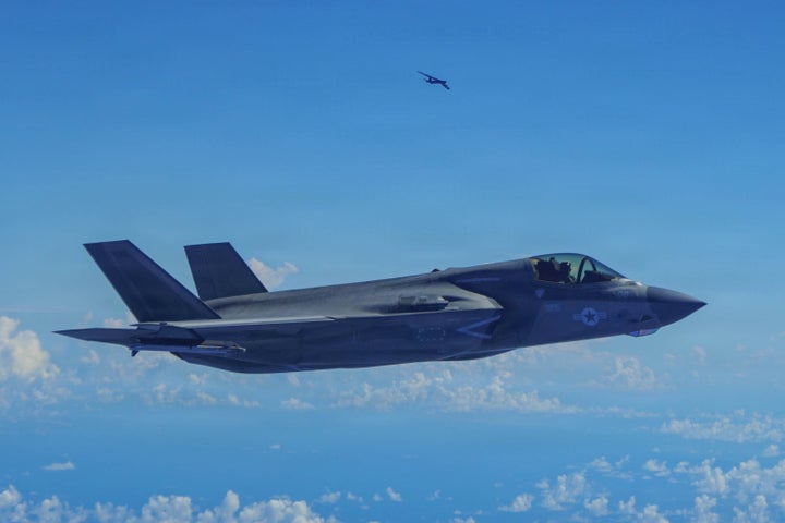 A Marine Corps F-35B Lightning II aircraft flies alongside a U.S. Air Force B-52H Stratofortress bomber in the U.S. Southern Command area of responsibility in Oct. 2025.