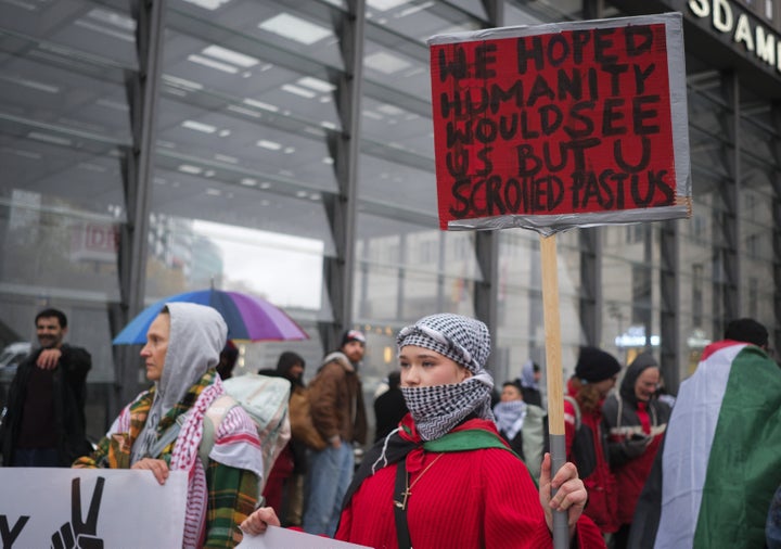 Demonstrators at Potsdamer Platz hold banners, placards and Palestinian flags while chanting "freedom for Palestine" to show their solidarity with Gazans in Berlin, Germany on Nov. 15, 2025.