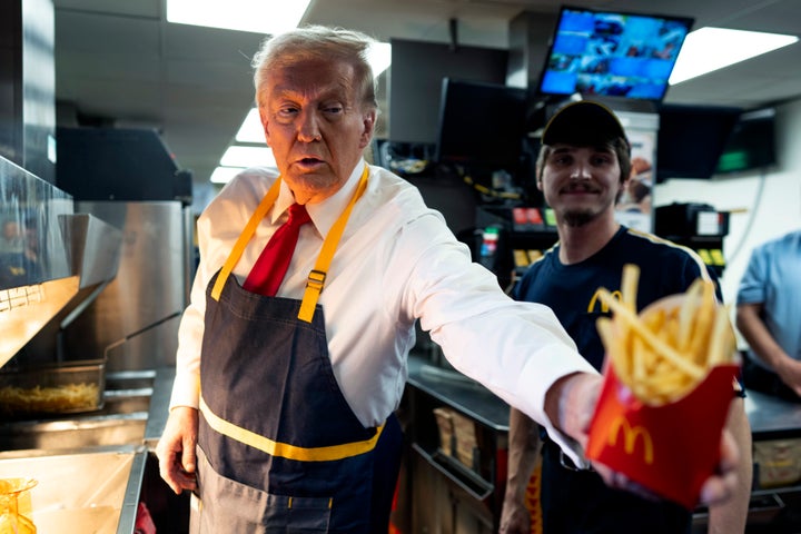 Donald Trump works behind the counter during a campaign event at a McDonald's restaurant on Oct. 20, 2024, in Feasterville-Trevose, Pennsylvania.