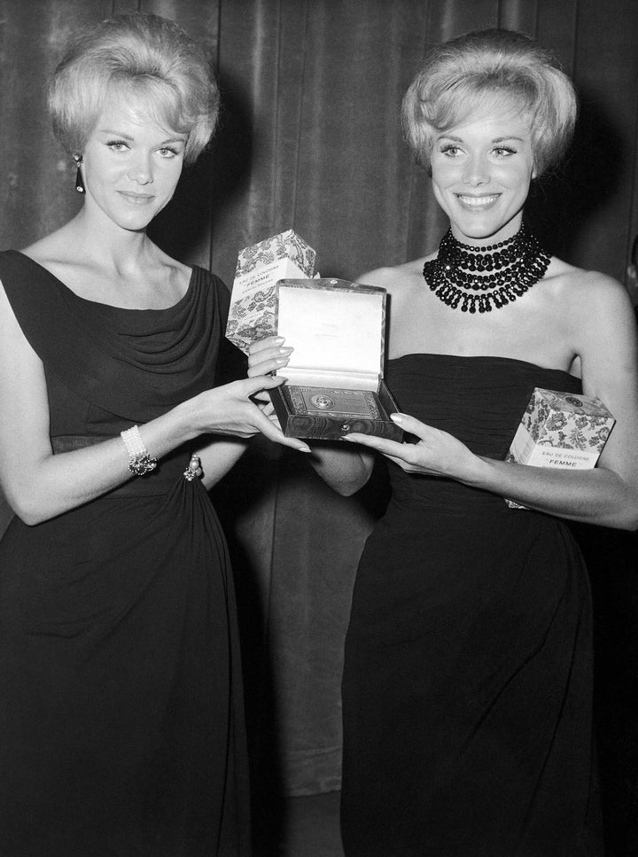 Alice, left, and Ellen Kessler show the “Maschera d’Argento” (Silver Mask) award presented to them by Italian newsmen in a fashionable Rome theater on Sept. 28, 1961, for their performances on Italian television. 