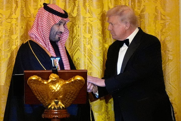 President Donald Trump shakes hands with Saudi Arabia's Crown Prince Mohammed bin Salman during a dinner in the East Room of the White House, Tuesday, Nov. 18, 2025, in Washington.