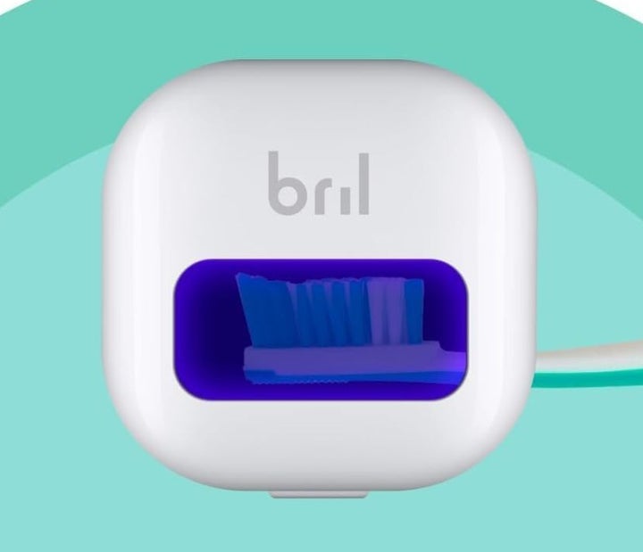The Bril UV holder doubles as a brush head cover and a sanitizer in one!