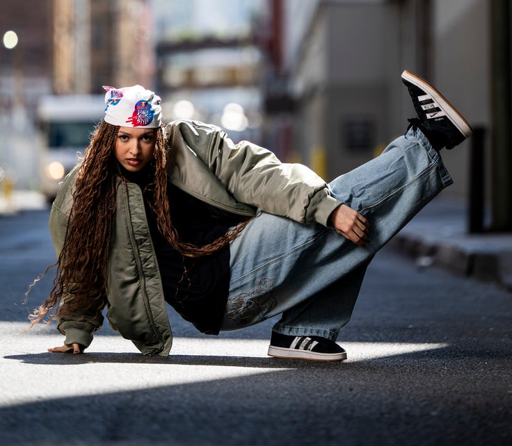 At the battle, Hightower competed in loose-fitting sweats paired with long, cascading braids that punctuated every move.