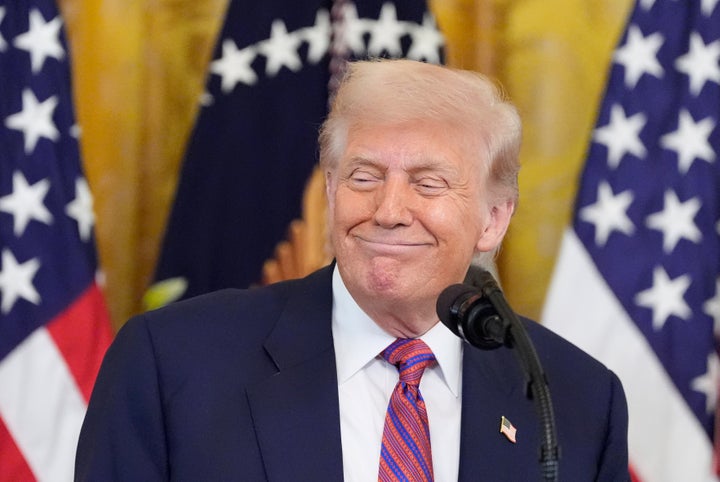 President Donald Trump smiles as he speaks at an event for the signing of the GENIUS Act, a bill that regulates stablecoins, a type of cryptocurrency, in the East Room of the White House, on July 18, 2025.