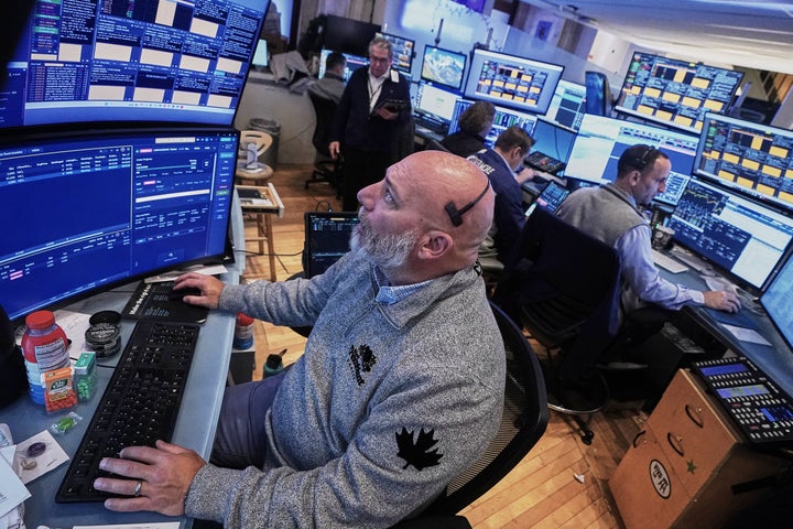 Trader Vincent Napolitono, foreground, works on the floor of the New York Stock Exchange, Thursday, Nov. 20, 2025. (AP Photo/Richard Drew)