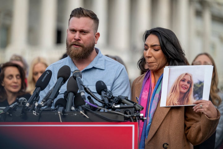 Sky Roberts, the brother of Epstein survivor Virginia Roberts Giuffre, and his wife, Amanda Roberts, speak outside the U.S. Capitol on Nov. 18, 2025. Amanda Roberts holds a photo of Giuffre, who died by suicide earlier this year.