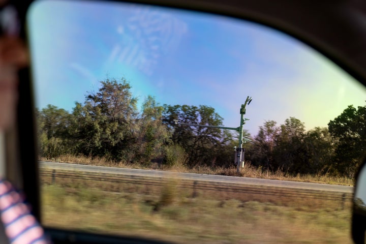 Alek Schott drives past license plate readers along Interstate 10, a route he occasionally takes for work trips, near Sequin, Texas, Wednesday, Oct. 15, 2025. (AP Photo/David Goldman)