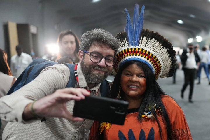 Brazil Indigenous Peoples Minister Sonia Guajajara (R) poses for a selfie while walking through the COP30 UN Climate Summit venue, on Nov. 17, 2025, in Belem, Brazil.