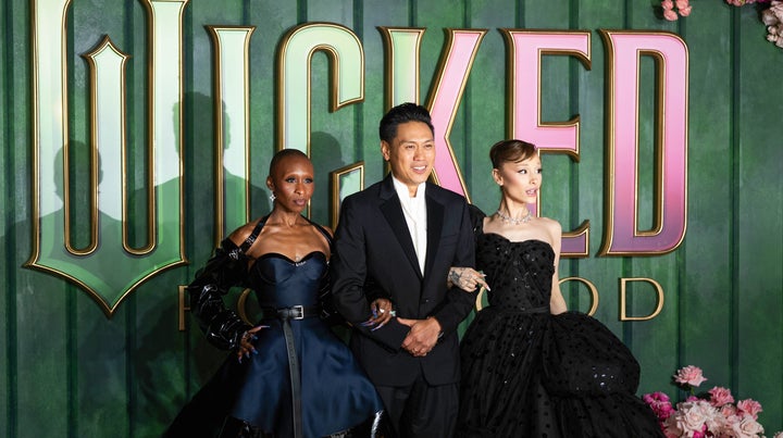 Cynthia Erivo, from left, Jon M. Chu and Ariana Grande pose for photographers upon arrival at the premiere of the film "Wicked For Good" in London, Monday, Nov. 10, 2025. (Photo by Scott A Garfitt/Invision/AP)