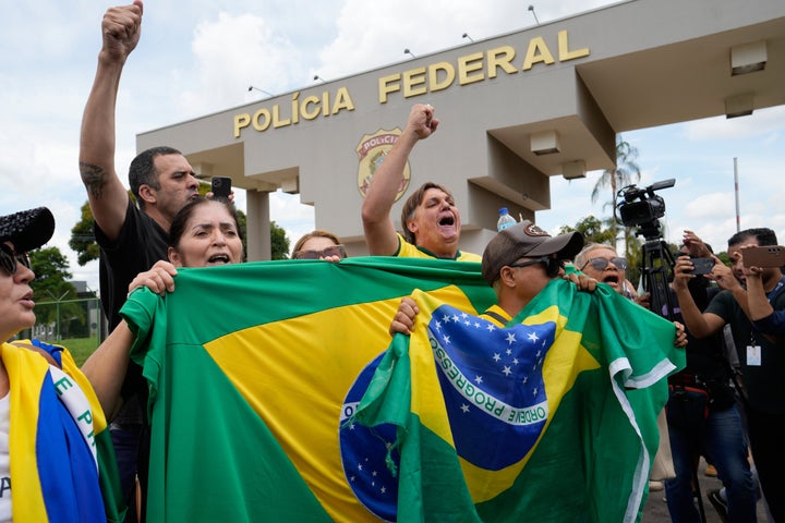 Supporters protest against the arrest of Brazil's former President Jair Bolsonaro outside the Federal Police headquarters, where Bolsonaro is under arrest in Brasilia, Brazil, on Nov. 22, 2025. 