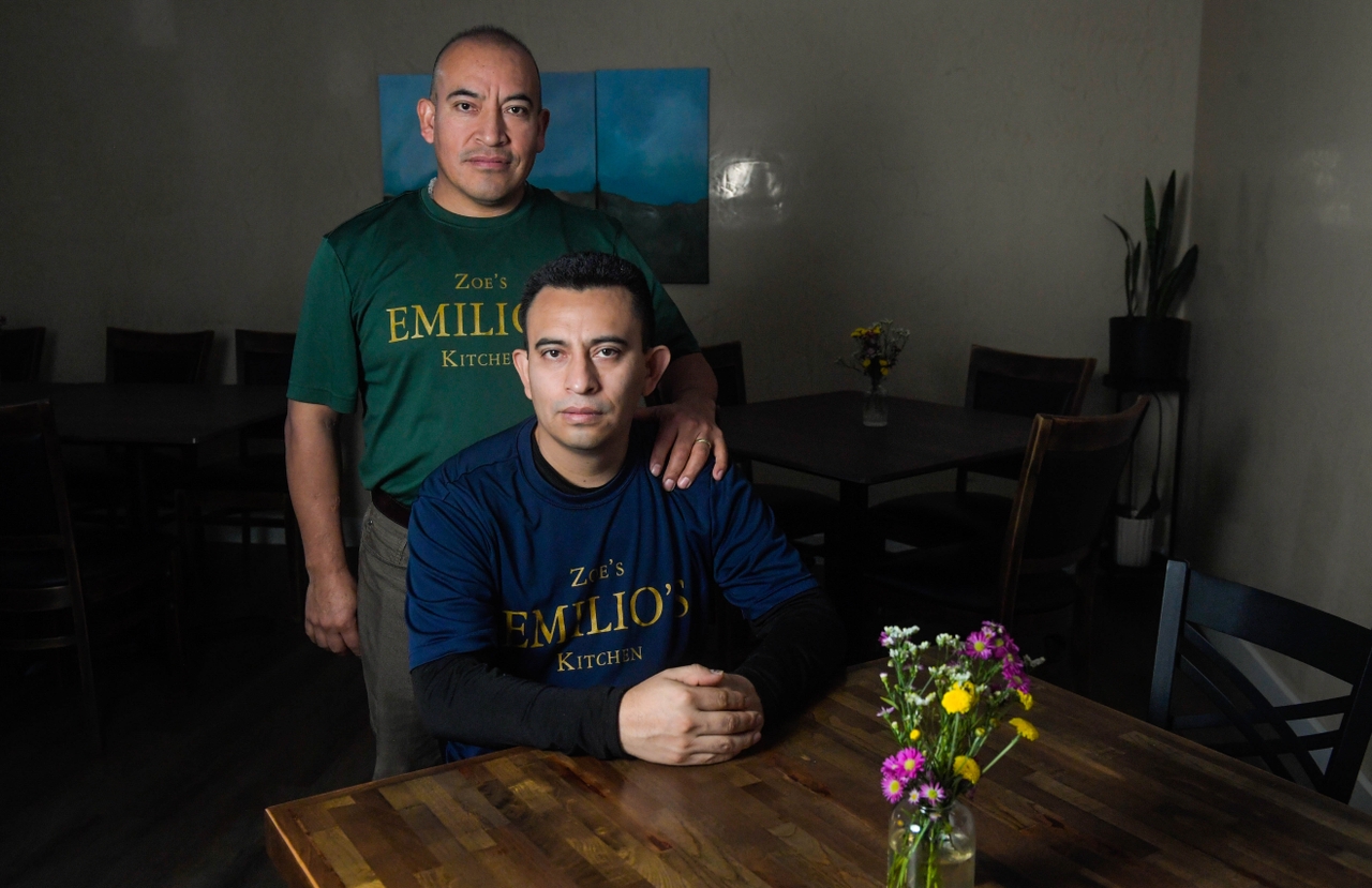 Ruperto Vicens-Marquez (right) and his brother, Emilio Vicens-Marquez, pose for a portrait at their restaurant, Emilio's Kitchen, on Saturday. Ruperto spent over a month detained in Newark, New Jersey, at Delaney Hall ICE Detention Center after being stopped by ICE agents while driving with two other men on Oct. 17. He was released from Delaney Hall on Nov. 18.