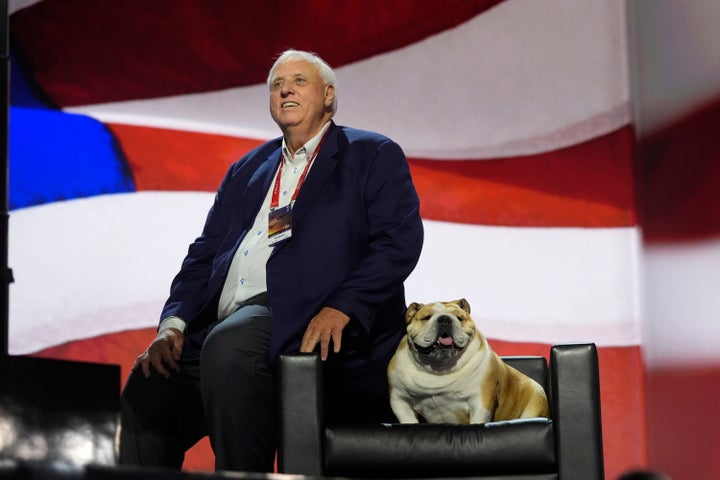 West Virginia Gov. Jim Justice checks out the stage with his dog, Babydog, before the Republican National Convention last year in Milwaukee.