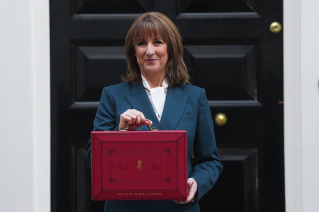 Chancellor of the Exchequer, Rachel Reeves, poses with the red Budget Box as she leaves 11 Downing Street to present the government's annual budget to Parliament, on November 26, 2025
