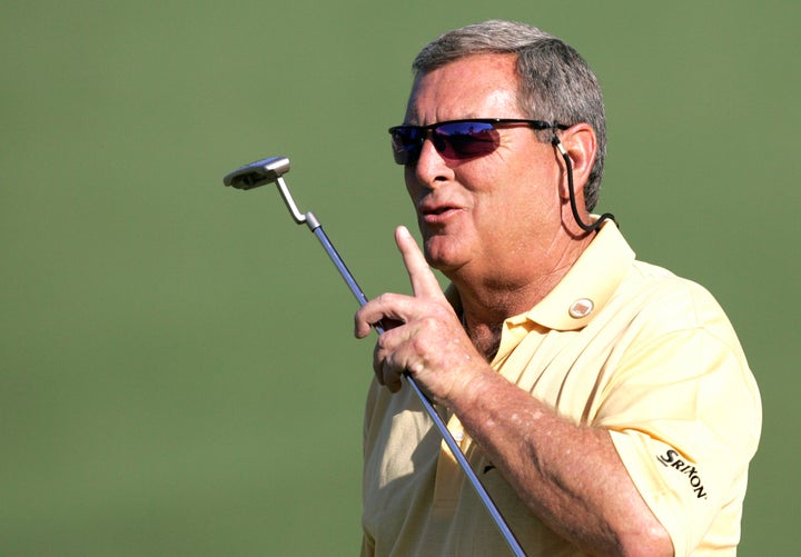 In this 2006 photo, Fuzzy Zoeller encourages the crowd to be quiet during play at the Masters golf tournament at the Augusta National Golf Club in Augusta, Georgia.