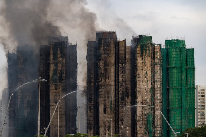 Firefighters continue to battle the deadly blaze at the Wang Fuk Court high-rise apartment complex for a second day in Hong Kong, Nov. 27, 2025.