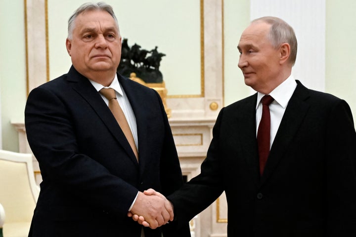 Russia's President Vladimir Putin and Hungary's Prime Minister Viktor Orban shake hands during a meeting at the Kremlin on Nov. 28, 2025.