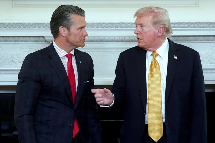 Secretary of Defense Pete Hegseth, left, and President Donald Trump, right, during an announcement about the National Security Task Force in the State Dining Room of the White House in Washington, DC, on October 23, 2025. 