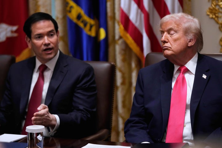 Secretary of State Marco Rubio speaks next to a sleepy-looking Trump, during Tuesday's Cabinet meeting.