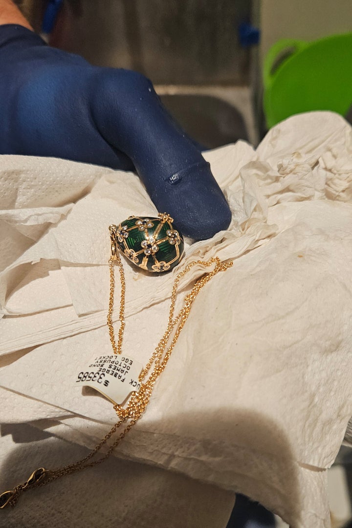 A Fabergé pendant is held after it was recovered from a man accused of stealing and swallowing the pendant.
