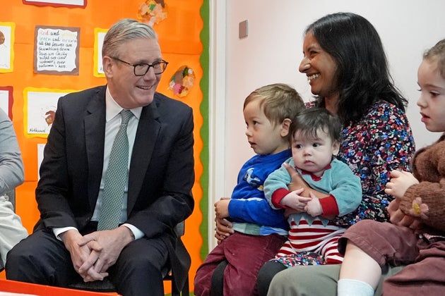 PM Keir Starmer speaks with parents and children during a visit to a nursery in central London ahead of his speech on backing the Budget, welfare reform and the scrapping of the two-child limit, on December 1.