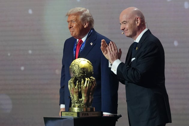 President Donald Trump receives the FIFA Peace Prize from FIFA President Gianni Infantino on Friday during the draw for the 2026 World Cup at the Kennedy Center in Washington.