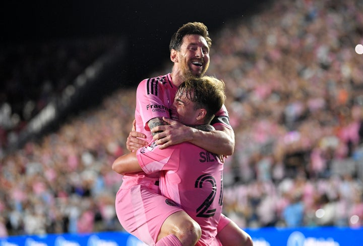 Inter Miami forward Lionel Messi, top, celebrates with forward Mateo Silvetti, bottom, after scoring during the first half of Game 3 in the first round of MLS soccer's Western Conference playoffs against Nashville SC in Fort Lauderdale, Fla., Nov. 8, 2025. (AP Photo/Michael Laughlin)